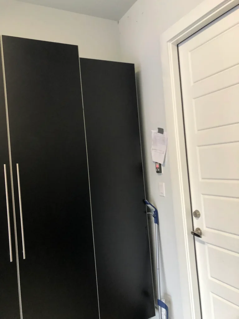 Corner cabinet detail near entry door