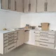 Custom garage cabinets with countertop workspace and drawers westlake project