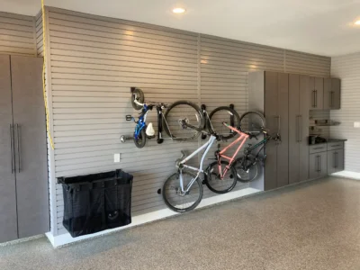bikes mounted vertically on a gray slatwall storage system Frisco TX